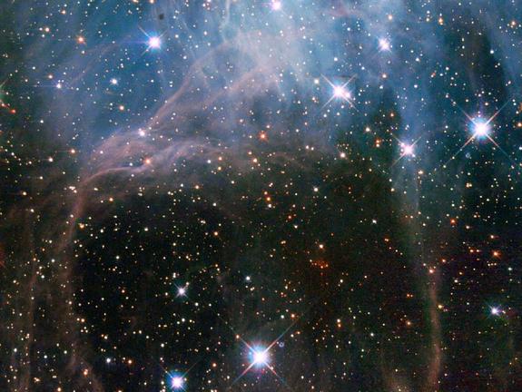 This image shows a young stellar grouping in one of the largest known star formation regions of the Large Magellanic Cloud, a dwarf satellite galaxy of the Milky Way. The picturesque view was captured by the Hubble Space Telescope's Wide Field Planetary Camera 2.