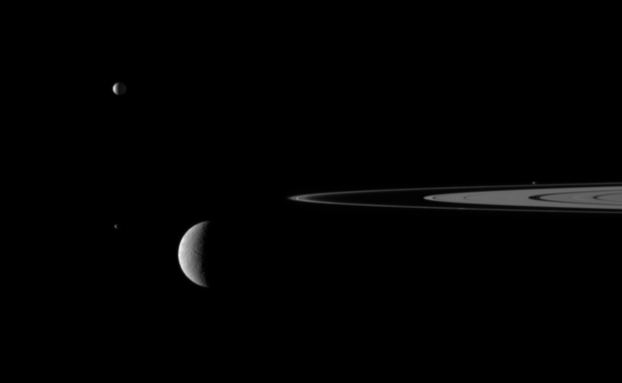 Saturn's Rings and Four Moons