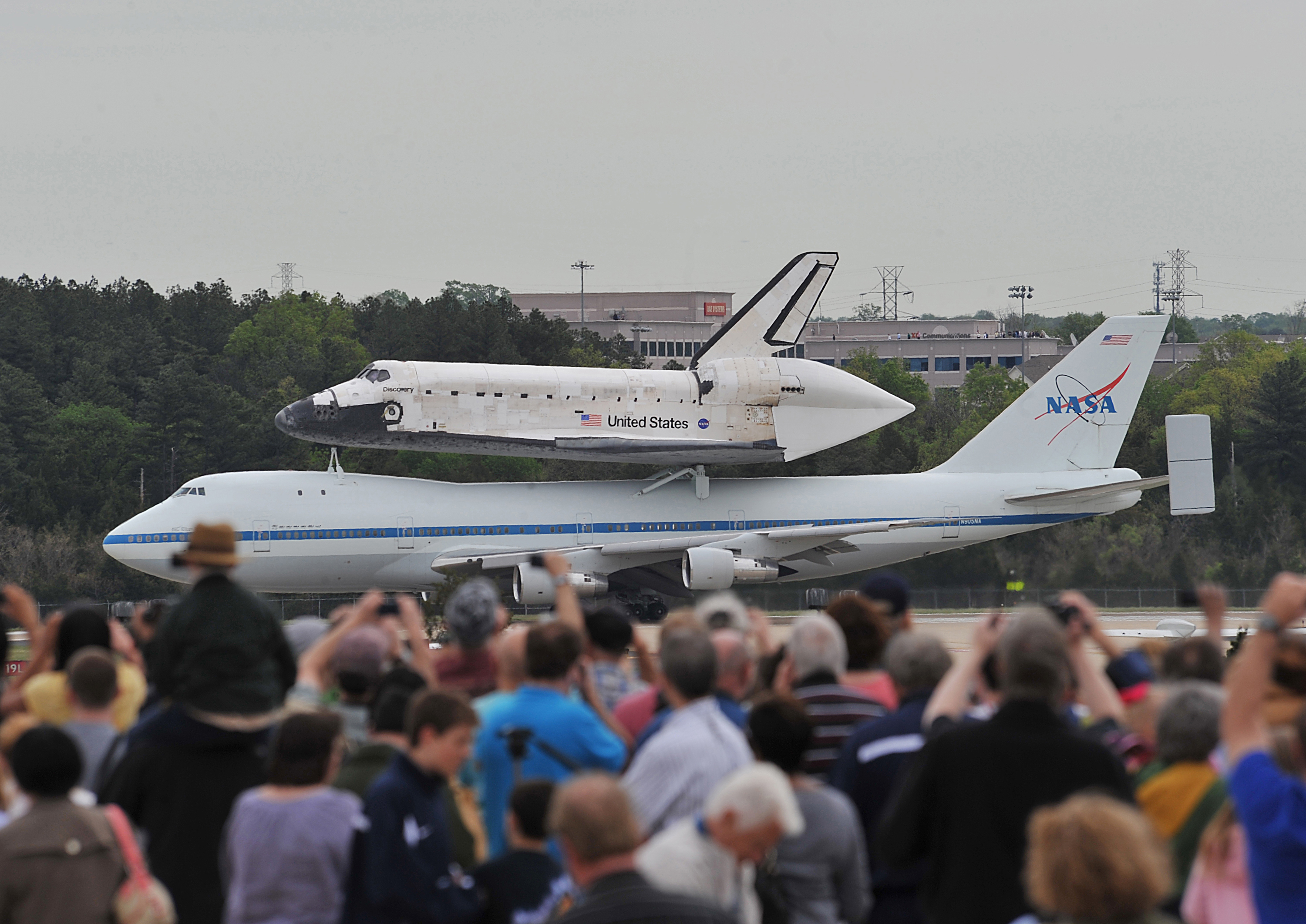 Crowd Watches Shuttle Discovery