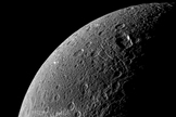 Wispy terrain reflects sunlight brightly in the lower left of this Cassini image of the northern latitudes of Saturn's moon Dione. Image taken December 20, 2010.