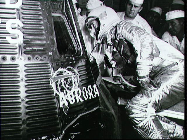 Astronaut Scott Carpenter Looks into Aurora 7 Capsule