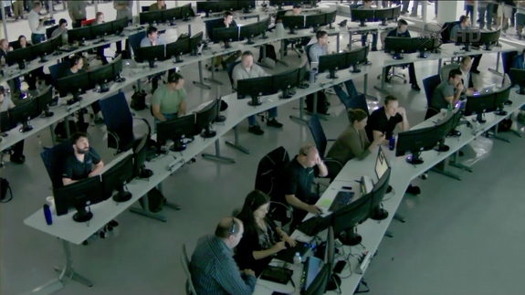 Elon Musk of SpaceX (3rd from right in front row, hand on his head), watches as the Dragon capsule returns to Earth, May 31, 2012.