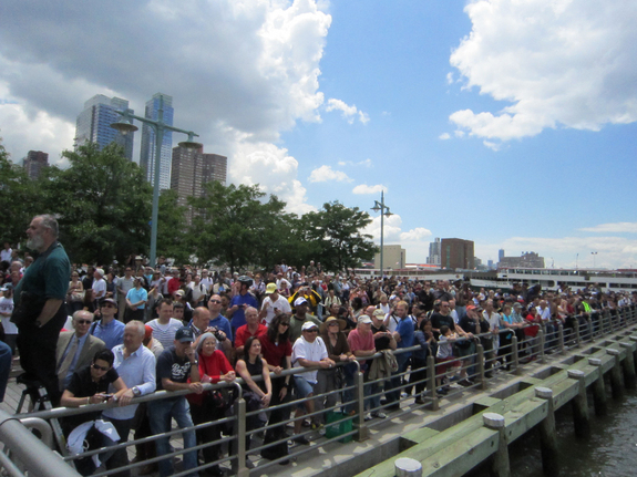 Hundreds of enthusiastic people watched as the space shuttle Enterprise arrived at its new home: New York City's Intrepid Sea, Air and Space Museum, June 6, 2012.