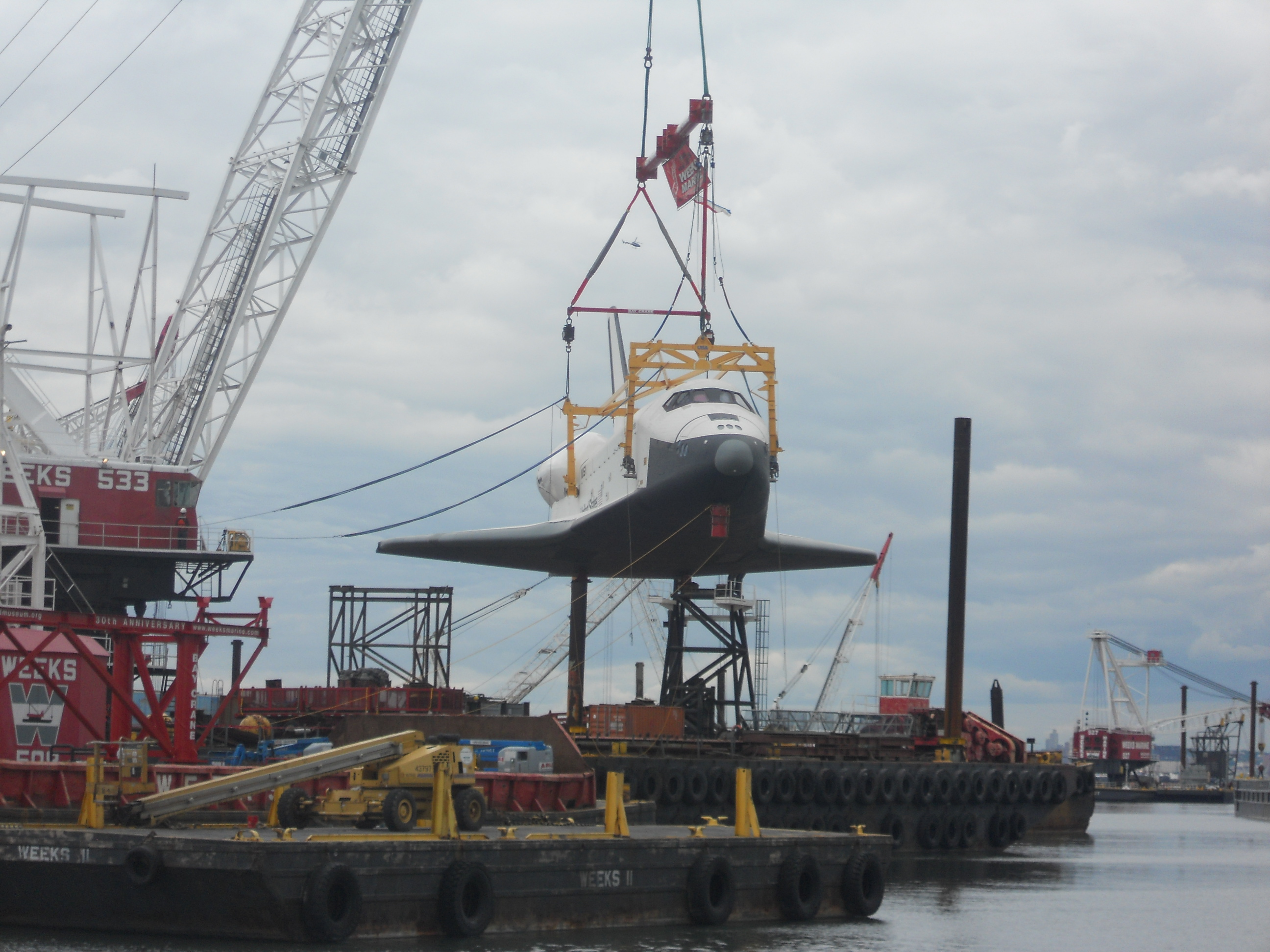 Enterprise Being Hoisted by Crane