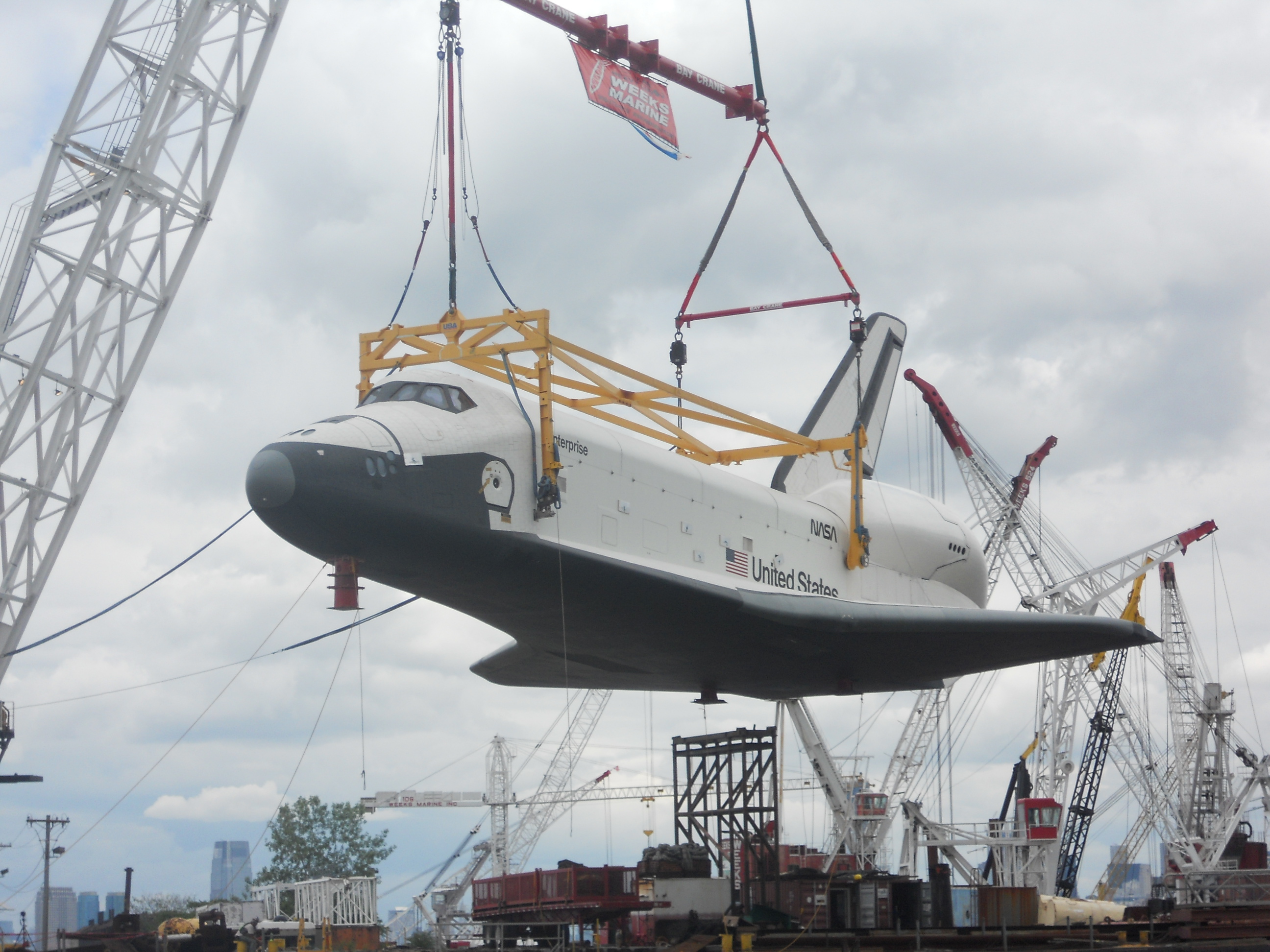 Enterprise Being Hoisted by Crane