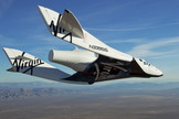 Virgin Galactic's first SpaceShipTwo spacecraft, the VSS Enterprise, glides over California's Mojave Air and Space Port in this view from a series of unpowered flight tests.