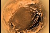 This distorted fish-eye projection shows a view of Titan’s surface from 5 kilometres above the surface. It is built with images taken during descent by the Descent Imager/Spectral Radiometer (DISR) on board ESA’s Huygens mission, on Jan. 14, 2005.