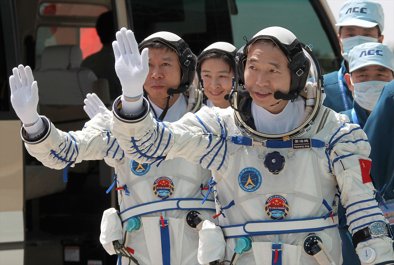 China's Shenzhou 9 Crew with Mission Patches