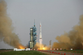 A Chinese Long March 2F rocket launches on the Shenzhou 9 mission, China's first manned space docking flight and first flight of a female astronaut, on June 16, 2012 from the Jiuquan Satellite Launch Center.