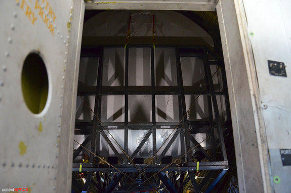 The Super Guppy's cargo for its flight to Seattle is the crew compartment from Johnson Space Center's Full Fuselage Trainer, a full-size mockup of the space shuttle. The 16,000 pound (7,300 kilogram) shuttle nose section (wrapped in plastic) was secured just behind the Super Guppy's cockpit door.