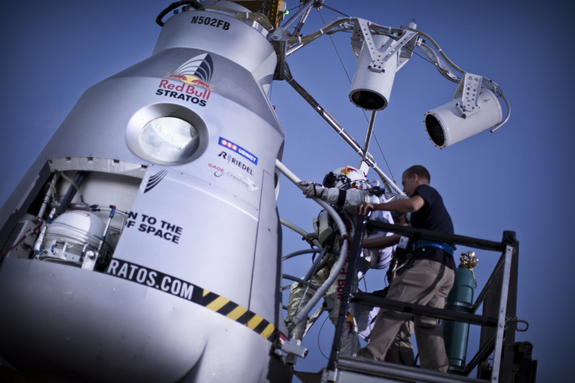 Daredevil skydiver Felix Baumgartner steps into his high-altitude balloon capsule in Roswell, N.M., during the second manned test jump for the Red Bull Stratos mission on July 25, 2012.