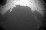 This photo shows the shadow of NASA's huge rover Curiosity on Mars just after its Aug. 5 PDT, 2012 landing in Gale Crater. This image is an enlarged version from the original 256-pixel image.