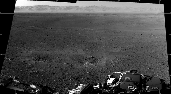 These are the first two full-resolution images of the Martian surface from the Navigation cameras on NASA's Curiosity rover, which are located on the rover's "head" or mast. The rim of Gale Crater can be seen in the distance beyond the pebbly ground. Images released Aug. 8, 2012.