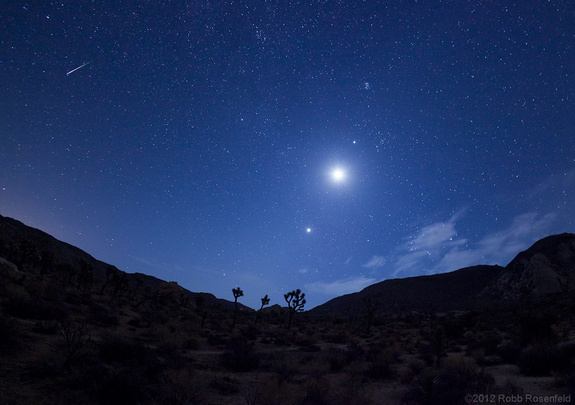 Night sky watcher Robb Rosenfeld took this photograph of a Perseid meteor with Venus, Jupiter, and the moon. He took the photos on August 12, 2012, in Joshua Tree National Park, located in southern California east of Los Angeles.