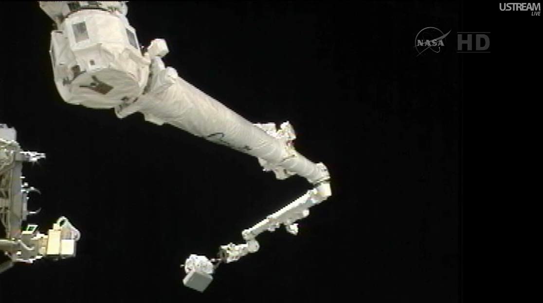 Spacewalker Akihiko Hoshide on Space Station Robotic Arm