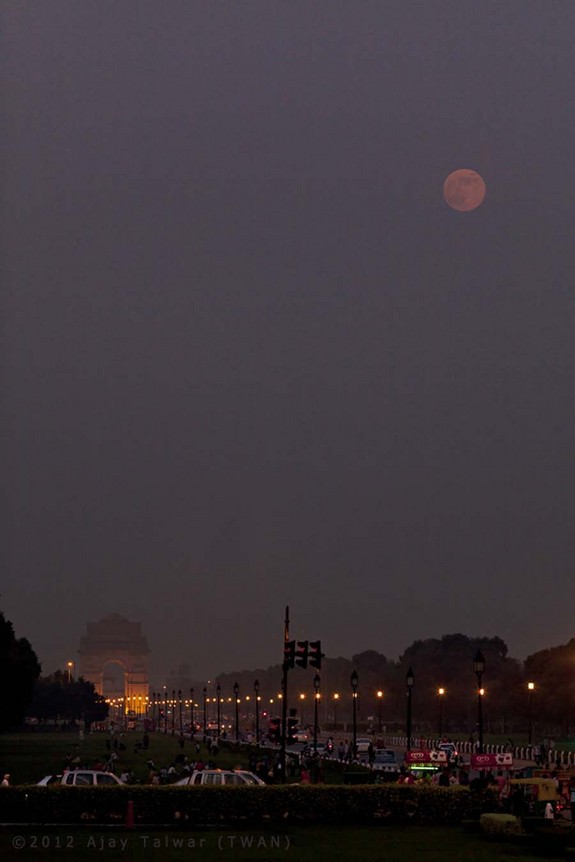 "Yesterday's blue moon was actually reddish when it rose over the Avenue Rajpath, New Delhi," wrote photographer Ajay Talwar. "Actually it was lucky to have been visible at all during the Indian Monsoons."