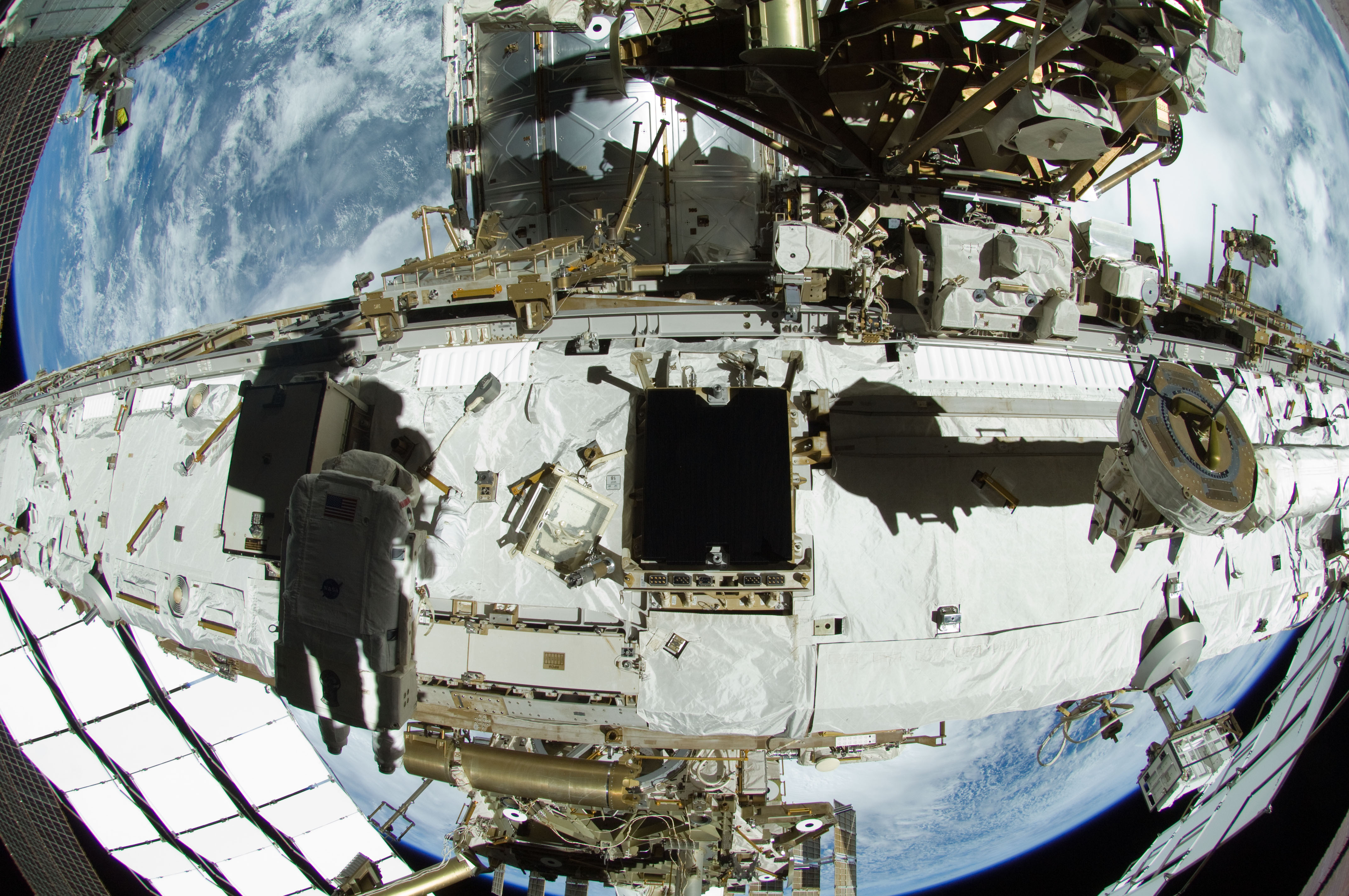 Astronauts Outfitting ISS