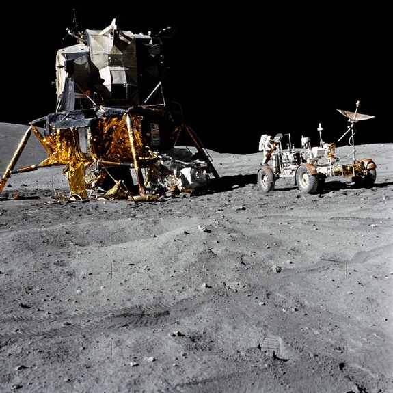 An excellent view of the Lunar Module (LM) “Orion” and Lunar Roving Vehicle (LRV), as photographed by astronaut Charles M. Duke Jr., lunar module pilot, during the first Apollo 16 extravehicular activity (EVA-1) at the Descartes landing site. Astronaut John W. Young, commander, can be seen directly behind the LRV. The lunar surface feature in the left background is Stone Mountain
