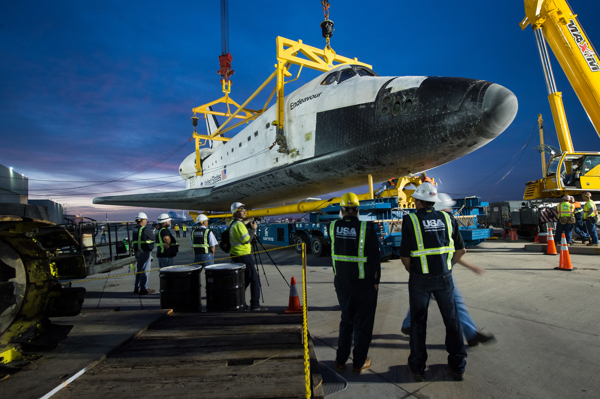 Shuttle Endeavour Hoisted Off Carrier Plane