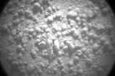 This photo, taken by the Curiosity rover's ChemCam instrument on Oct. 8, 2012, shows a close-up view of the piece (visible slightly below and to the left of the photo's center) that apparently fell off the robot.