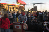 A vendor cooks bacon-wrapped hot dogs outside the designated viewing lot near shuttle Endeavour's museum home on Oct. 13, 2012.