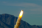 Blue Origin’s pusher escape system rockets the Crew Capsule away from the launch pad, demonstrating a key safety system for both suborbital and orbital flights. Image released Oct. 22, 2012.