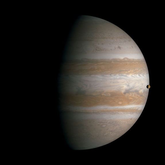 Transit of Io across Jupiter. South is up in this view. Mosaic composite photograph. Cassini, January 1, 2001.