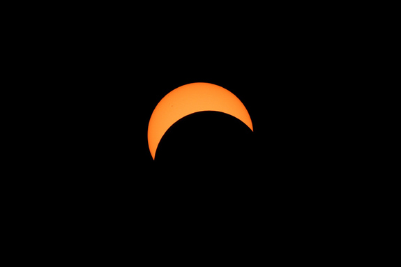This portrait of the sun partially covered by the moon was taken by Imelda Joson and Edwin Aguirre through a solar-filtered telescope during the March 29, 2006 total solar eclipse in Egypt.