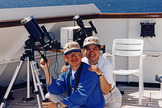Veteran eclipse chasers Imelda Joson and Edwin Aguirre were all smiles after successfully observing the total solar eclipse on Feb. 26, 1998 aboard the MS Veendam in the Caribbean Sea.