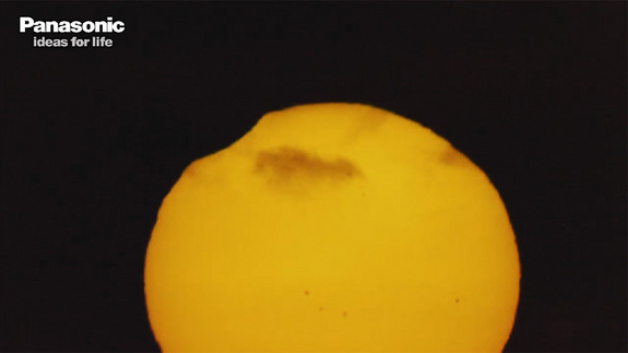 "First contact, woo hoo!" call the crowds from Australia as the moon first starts to obscure the corner of the sun during a total solar eclipse Nov. 13, 2012.