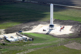 Grasshopper consists of a Falcon 9 rocket first stage, Merlin 1D engine, four steel landing legs with hydraulic dampers, and a steel support structure. For a sense of its scale, note the blue pick-up truck to the left of Grasshopper in the photo above.