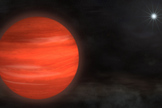 The "super-Jupiter" Kappa Andromedae b, shown here in an artist's rendering, circles its star at nearly twice the distance that Neptune orbits the sun. With a mass about 13 times Jupiter's, the object glows with a reddish color.