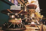A mockup of the Venera 13 spacecraft is displayed at the Cosmos Pavilion of the Exhibition of the Achievements of the National Economy in Moscow, Russia. The lander module in the foreground would sit inside the brown sphere atop the Venera spacecraft (background).
