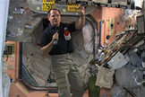 NASA astronaut Kevin Ford holds a packet of smoked turkey that will up part of the space station crew's Thanksgiving feast on Nov. 22, 2012.