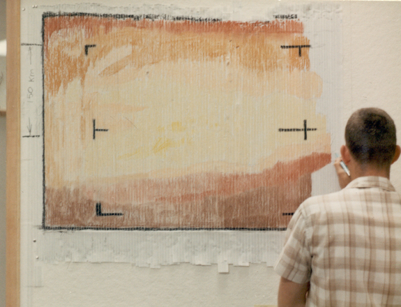 A "real-time data translator" machine converted Mariner 4 digital image data into numbers printed on strips of paper. Too anxious to wait for the official processed image, employees from the Voyager Telecommunications Section attached these strips side by side to a display panel and hand-colored the numbers like a paint-by-numbers picture.