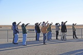 Skywatchers view Virgin Galactic's SpaceShipTwo's glide to tarmac touchdown at the Mojave Air and Space Port in California.