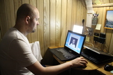 A volunteer in the Mars500 mock Mars mission performing a test of reaction time during the 520-day endurance simulation.