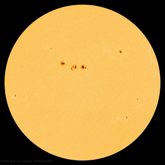 This image from NASA's Solar Dynamics Observatory was captured on Jan. 13, 2013, at 8:13 p.m. EST. At the center sits a large cluster of sunspots, dubbed Active Region 11654.