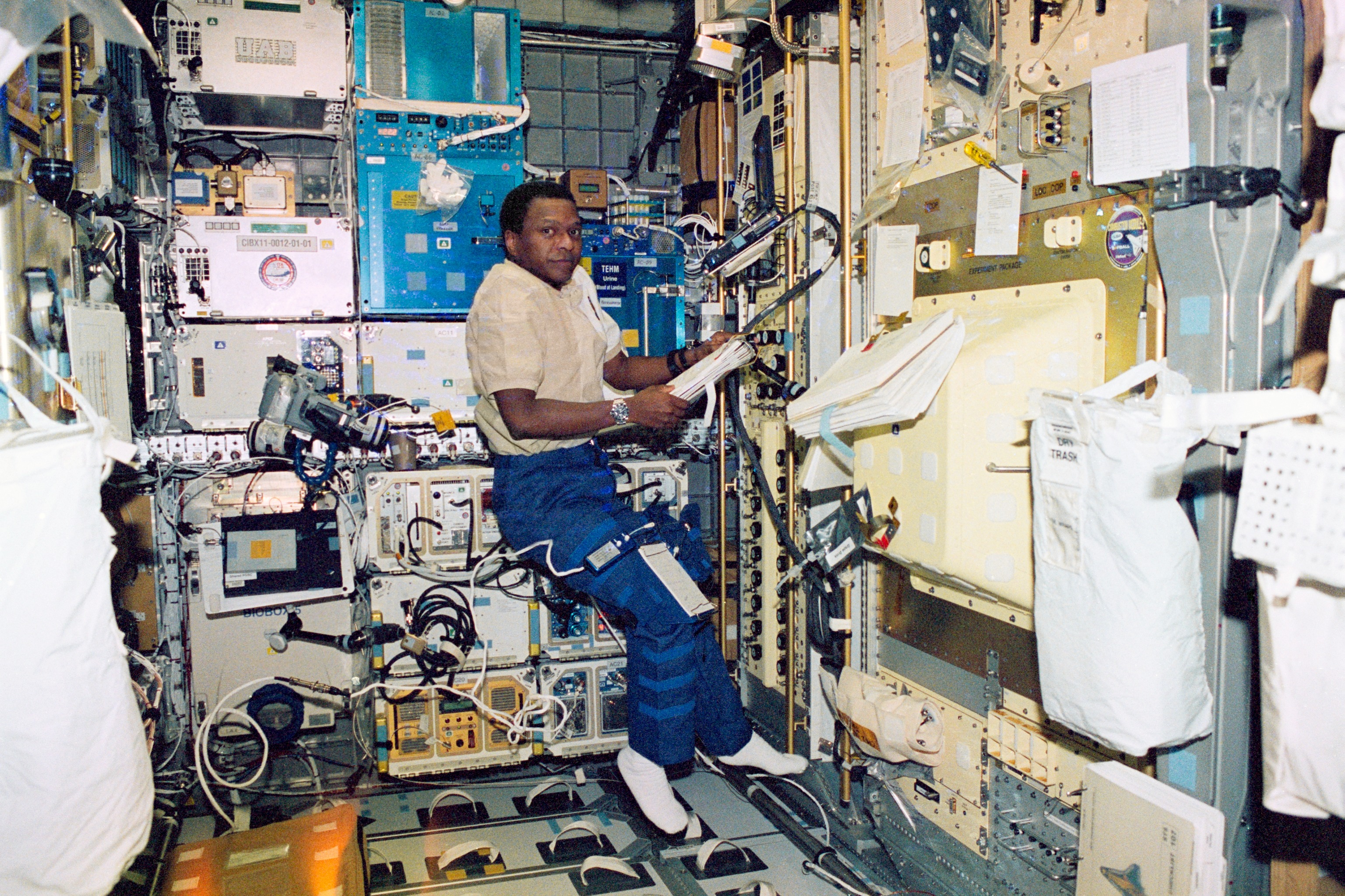 Astronaut Michael Anderson Checking Procedures on STS-107
