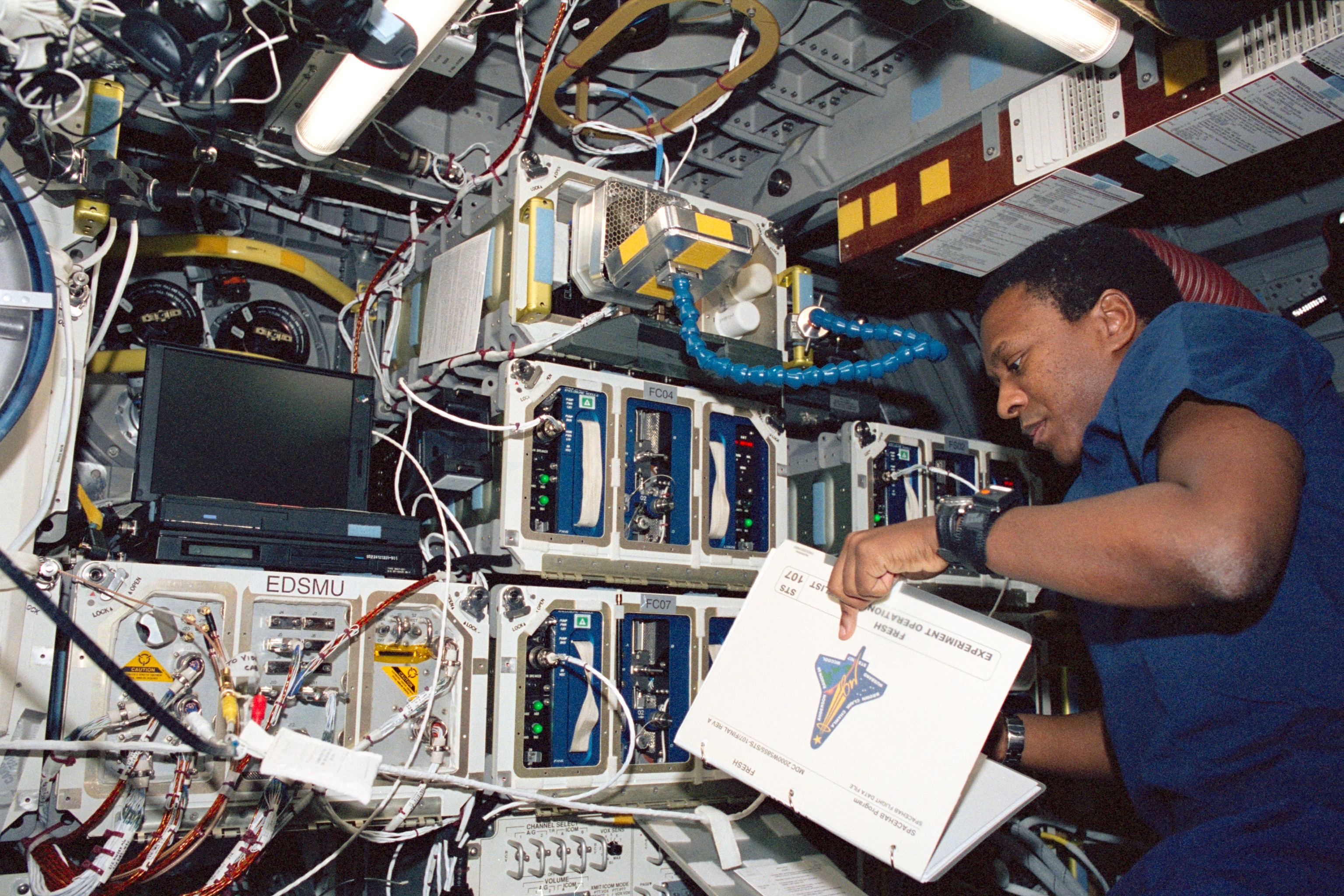 Astronaut Michael Anderson Reads a Checklist
