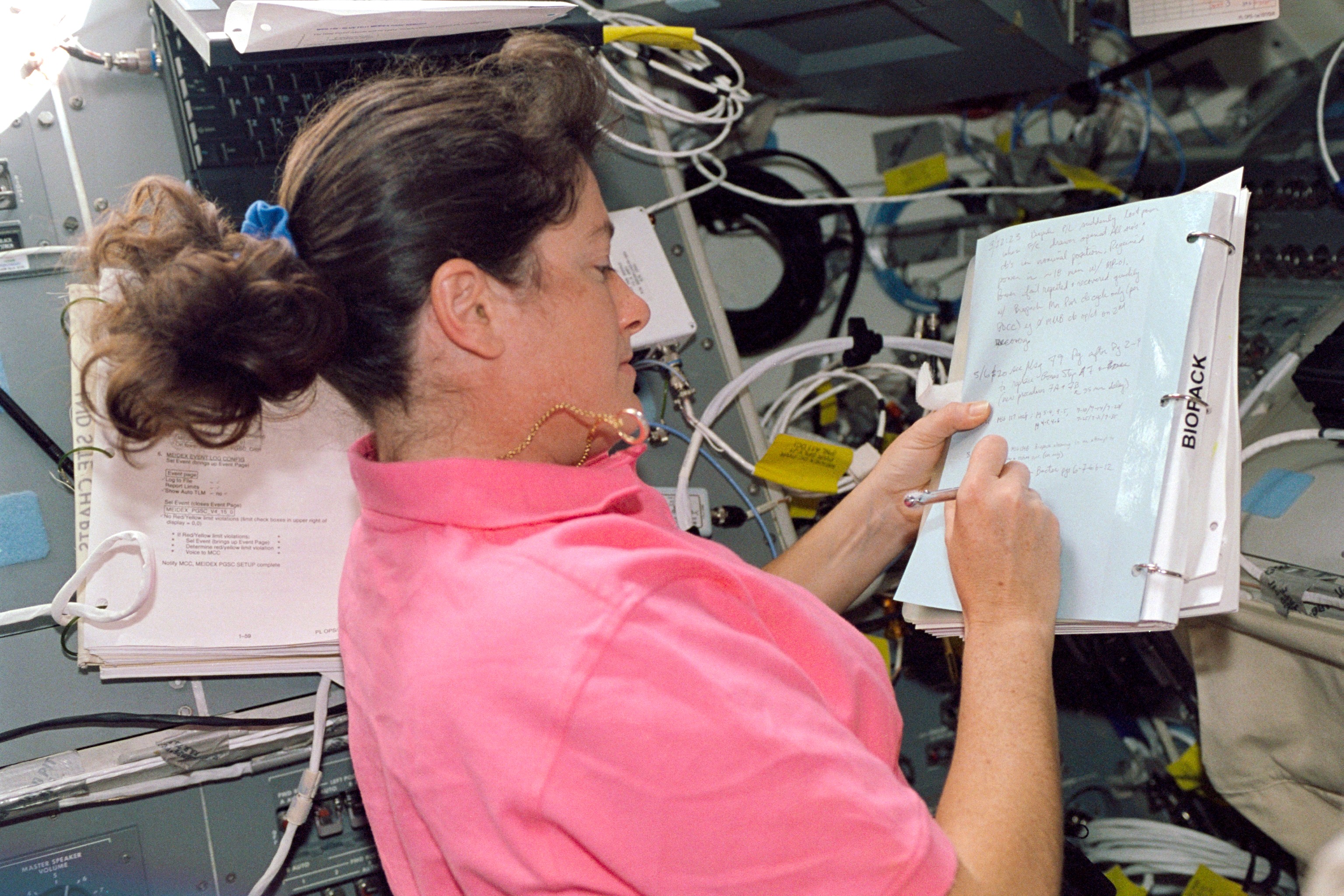 Astronaut Laurel Clark Checks Experiment