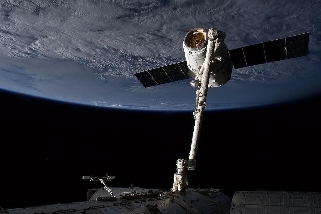 Dragon Captured by Space Station Robotic Arm