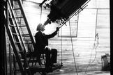 In a historical photo, Percival Lowell looks through the Clark telescope at Lowell Observatory, Flagstaff, Arizona. File photo undated.