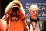Jim Whittaker, the first American to climb to the top of Mount Everest, poses with the gear he wore on that expedition at the 2013 Explorers Club dinner.