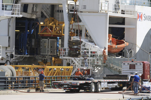 Workers unload parts for two Apollo Saturn V F-1 rocket engines recovered from the ocean floor by a private expedition led by Jeff Bezos, founder and CEO of Amazon.com and the commercial spaceflight company Blue Origin.