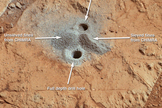 The first drill holes on Mars by NASA's Curiosity rover are seen in this image taken by the rover on March 29, 2013 at the John Klein rock in the Yellowknife Bay area of Mars' Gale Crater.