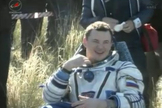 Soyuz commander Roman Romanenko, a Russian cosmonaut, smiles after being pulled from his Soyuz spacecraft following a smooth landing on May 14, 2013 (May 13 EDT) to end a five-month mission to the International Space Station.
