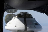 A model of NASA's Orion spacecraft is poised to be dropped from a C-17 airplane 25,000 feet (7,620 meters) above the Arizona dessert to test its parachute system on May 1, 2013.