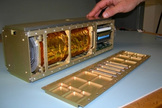Sara Seager brought to the panel discussion a model of a lower-cost nanosatellite dedicated to exoplanet discovery. This image reveals the inner workings of a standard nanosatellite.