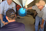 UP Aerospace personnel load a technology payload into the nose of the firm's SpaceLoft 7 suborbital rocket at Spaceport America in New Mexico. The rocket is slated to carry seven experiments into suborbital space on June 21, 2013.